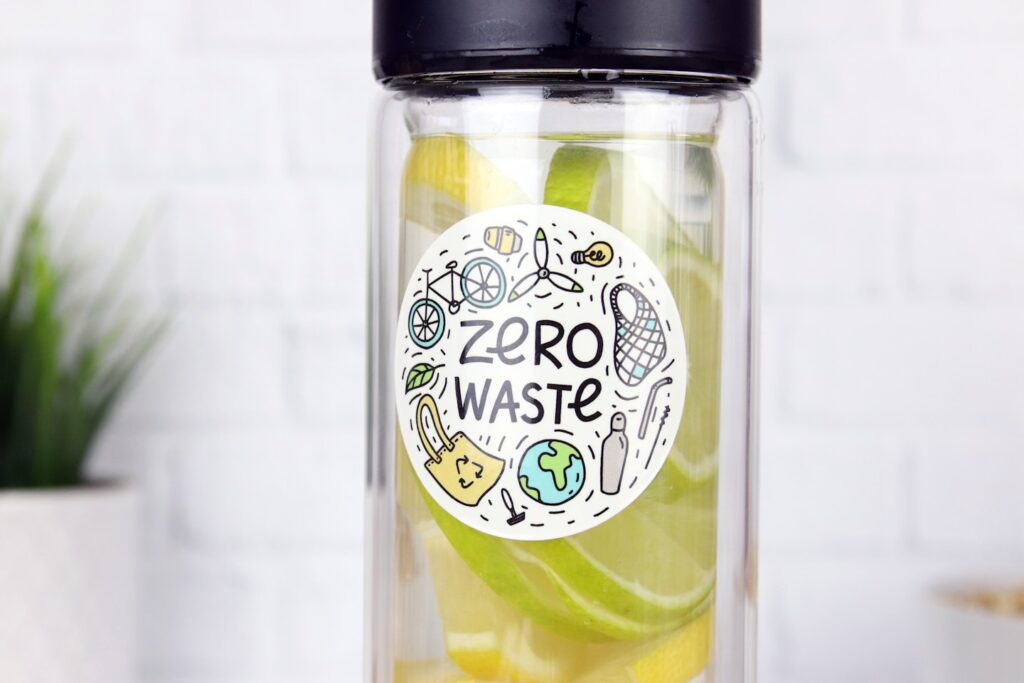 Circle eco-friendly sticker applied to a clear water bottle