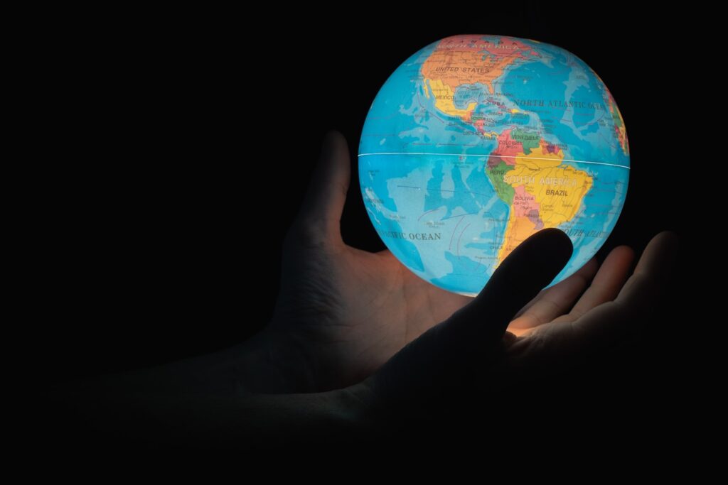 Earth in the hands of a man showing North America and South America